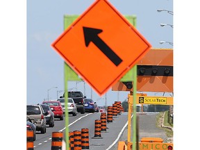 A merge sign in a road construction zone.