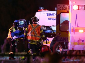 Windsor Fire Service, Essex-Windsor EMS paramedics, and Windsor police work the scene of a motor vehicle accident with with three serious injuries in the eastbound lanes of E.C. Row Expressway at Walker Road in Windsor, Ontario. (JASON KRYK/The Windsor Star)