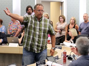 David Cassidy tries to convince Essex council, which was filled to capacity, to listen to those in attendance as they discuss flooding problems during a council meeting in Essex on Tuesday, Sept. 8, 2015. (TYLER BROWNBRIDGE/The Windsor Star)