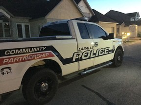 A LaSalle police cruiser sits in front of a home on Crystal Harbour Drive on Thursday, Sept. 17, 2015. (JASON KRYK/The Windsor Star)