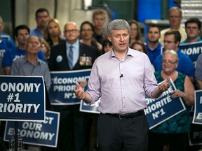 Prime Minister Stephen Harper is joined by local Conservative candidates as he speaks to supporters at Anchor Danly, Sunday, Sept. 20, 2015.  (DAX MELMER/The Windsor Star)