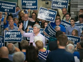 Prime Minister Stephen Harper is joined by local Conservative candidates as he speaks to supporters at Anchor Danly, Sunday, Sept. 20, 2015.  (DAX MELMER/The Windsor Star)