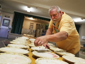 Doug Brookbanks prepares pies that will be sold at the  Harrow United Church A.O.T.S. Men's Club Pie Tent  during the 2015 Harrow Fair in Harrow, Ontario on September 2, 2015.  (JASON KRYK/The Windsor Star)