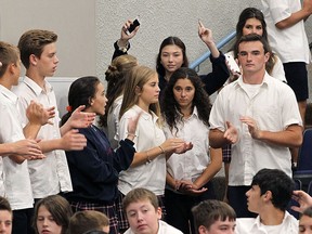 Students at Holy Names High School participated in a fundraiser on Thursday, Sept. 24, 2015, to help a fellow student who was recently diagnosed with cancer. Grade 9 student Arnie Furman has been receiving treatment in London while dealing with the diagnosis. Students are shown doing laps in the auditorium during the event. (DAN JANISSE/The Windsor Star)