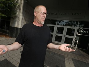 Dan Robinson, 51, is pictured outside City Hall Sqaure East, Friday, Sept. 4, 2015.  Robinson has been out of work for nearly a year and a half.  (DAX MELMER/The Windsor Star)