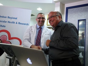 Dr. Al Kadri and supporter Mike Schlater announce the fundraiser Caring Kiss Campaign at his offices in Windsor on Wednesday, Sept. 9, 2015.                             (TYLER BROWNBRIDGE/The Windsor Star)