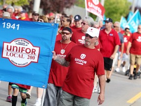 File photo of UNIFOR members walking down Walker Rd. for the Labour Day parade, Monday, Sept. 1, 2014.  (DAX MELMER/The Windsor Star)
