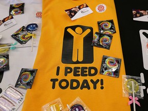 A t-shirt and condoms are shown at the University of Windsor Ts 4 Pee event on Monday, Sept. 21, 2015. Organizers were attempting to break a national record for the most number of people tested for a sexually transmitted infection at one location in 24 hours. (DAN JANISSE/The Windsor Star)
