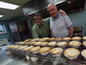 Bob Nagy and Larry Skinner are photographed with some of the latest meat pies that will be for sale at the Bedford United Church in Windsor on Wednesday, Sept. 9, 2015.                             (TYLER BROWNBRIDGE/The Windsor Star)