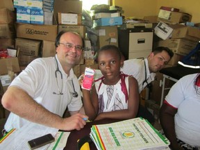 Dr. Chris Spirou, left. Handout photos from a trip to Assin Bereku, Ghana, Africa on November 1st.
