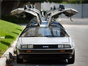 This Sept. 10, 2013 photo shows DeLorean cars parked outside The DeLorean Motor Company in Huntington Beach, Calif. The cars were made from 1981-83 and were known for their stainless steel body and gull-wing doors. About 9,000 of the cars were made. People are having DeLoreans outfitted to resemble the car from the 1985 movie "Back to the Future."