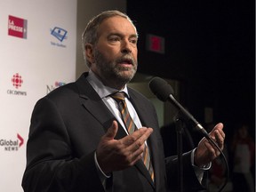 NDP Leader Tom Mulcair fields questions after the  French-language debate in Montreal on Thursday, Sept. 24, 2015.