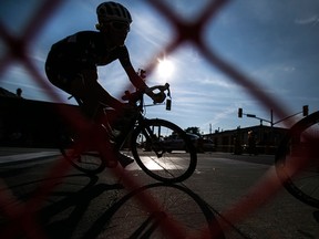 A cyclist turns the corner at Erie St. and Howard Ave. while competing in the Pro Race at the Tour di via Italia, Sunday, Sept. 6, 2015.  (DAX MELMER/The Windsor Star)