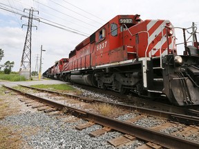 A CP Rail freight train rolls through Windsor, ON. at the McDougall Ave. crossing north of Eugenie St. E. on Friday, July 3, 2015. (DAN JANISSE/The Windsor Star)