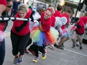 Karlene Nielsen, centre, sports a tutu as she helps the United Way team during the 3rd Annual Ram Tough Truck Pull in downtown Windsor, Sunday, Sept. 20, 2015.  The event was able to raise an estimated $44,000 for United Way/Centraide Windsor-Essex.  (DAX MELMER/The Windsor Star)
