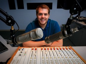 Former host of a personal finance radio show at McMaster University, Tyler Welch, sits in the broadcast booth at CFMU at McMaster.  (Glenn Lowson for National Post)