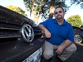 Matthew Quenneville, and his Volkswagen vehicle in Windsor, Ontario on September 22, 2015.  Quenneville, is a plaintiff in a class action lawsuit  against Volkswagen AG.  (JASON KRYK/The Windsor Star)
