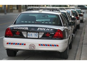 Windsor Police cruisers are shown near the downtown headquarters.