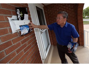 Conservative candidate Henry Lau campaigns in the riding of Windsor West on Monday, September 28, 2015.                                 (TYLER BROWNBRIDGE/The Windsor Star)