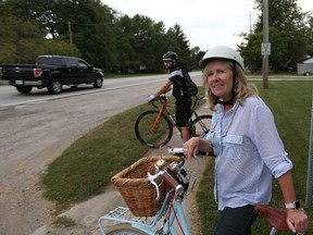 Lori Newton and Oliver Swainson from Bike Friendly Windsor-Essex ride their bikes near Cabana Road West and Granada Avenue in Windsor, Ont., on Monday, Sept. 28, 2015.