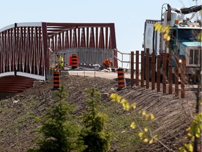Windsor, Ontario. September 16, 2015 - Workers continue with construction of Cousineau Road pedestrian bridge near St. Clair College September 16, 2015.  The bridge will link the east and westbound path so pedestrians will not have to navigate Cousineau Road intersection with Highway 3 and Herb Gray Parkway.  (NICK BRANCACCIO/The Windsor Star)