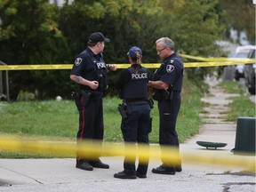 Windsor police investigate a crime scene on Brant St. and Louis Ave. in Windsor, Ontario on September 29, 2015.