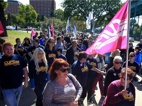 Windsor, Ontario. September 30, 2015 -- Candy Donaldson, centre, CUPE Local 1393,  leads a group of CUPE Local 1001 members and  Windsor University Faculty Assoc. members during a protest rally against outsourcing of jobs September 30, 2015.  (NICK BRANACCIO/The Windsor Star)