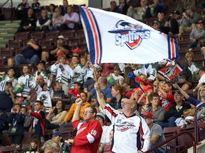 Fans celebrate a first period Windsor Spitfires goal  during  the Ontario Hockey League opening game against the Erie Otters at the WFCU Centre in Windsor, Ontario on September 24, 2015. (JASON KRYK/The Windsor Star)