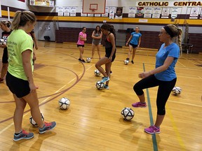 Volunteers participate in the GOALS program training at Catholic Central High School in Windsor recently. The program is dedicated to teaching girls fundamental skills in various sports. (TYLER BROWNBRIDGE / The Windsor Star)