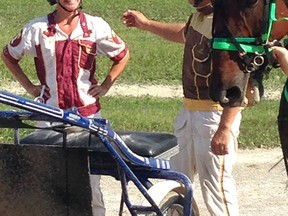 Star health reporter Kelly Steele talks with harness race driver Chris Johnston following the family day media race at Leamington Raceway.