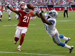 Detroit Lions wide receiver Calvin Johnson (81) cannot pull in a pass as Arizona Cardinals cornerback Patrick Peterson (21) defends during the first half of an NFL football game on Sunday, Dec. 16, 2012, in Glendale, Ariz. (AP Photo/Ross D. Franklin)