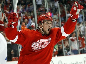 Detroit Red Wings' Justin Abdelkader celebrates his goal against the Toronto Maple Leafs in the second period of an NHL hockey game in Detroit Friday, Oct. 9, 2015. It was Abdelkader's third goal of the game. (AP Photo/Paul Sancya)