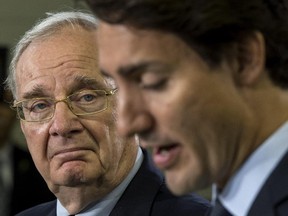 Former prime minister Paul Martin listens to Liberal Leader Justin Trudeau during an economic presentation on Tuesday, August 25, 2015 in Toronto. THE CANADIAN PRESS/Paul Chiasson
