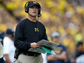 Head coach Jim Harbaugh of the Michigan Wolverines looks on during the fourth quarter while playing the UNLV Rebels on September 19, 2015 at Michigan Stadium in Ann Arbor, Michigan. Michigan won the game 28-7. (Photo by Gregory Shamus/Getty Images)