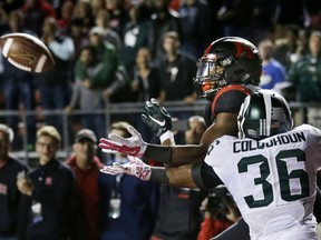 Windsor's Arjen Colquhoun, right, gets a hand in to break-up a pass to Rutgers wide receiver Leonte Carroo during the second half of an NCAA college football game Saturday, Oct. 10, 2015, in Piscataway, N.J. Michigan State won 31-24. (AP Photo/Mel Evans)
