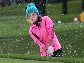 Tess Scaman of Chatham-Kent Secondary School hits out of a bunker on Thursday, Oct. 15, 2015, during the OFSAA girls golf championship at Roseland Golf Club in Windsor, ON. (DAN JANISSE/The Windsor Star)