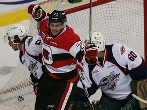 Tecumseh's Sam Studnicka celebrates a goal in front of the Windsor Spitfires Jalen Chatfield and Michael Giugovaz at the WFCU Centre in Windsor on Thursday, October 15, 2015.                                      (TYLER BROWNBRIDGE/The Windsor Star)
