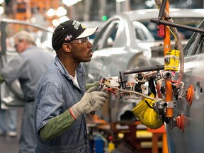 A GM employee works on the line in this file photo. ((Photo by Steve Fecht/General Motors via Getty Images)