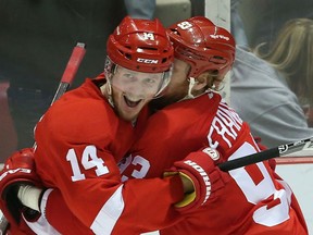Detroit's Gustav Nyquist, left, is congratulated by  Johan Franzen against the Boston Bruins at Joe Louis Arena. (Photo by Leon Halip/Getty Images)