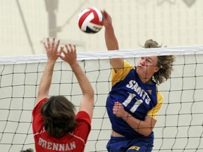 St. Anne's Shane Way spikes the ball at F.J. Brennan's Aaron Russette at St. Anne Catholic High School in Lakeshore on Wednesday, October 21, 2015.                                      (TYLER BROWNBRIDGE/The Windsor Star)