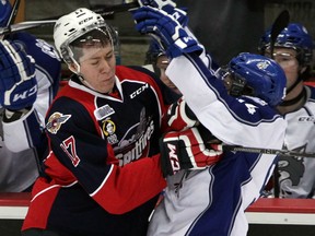 Spits Logan Stanley, left, stops Wolves Brody Silk in first period of OHL action from WFCU Centre, Thursday January 15, 2015. (NICK BRANCACCIO/The Windsor Star)