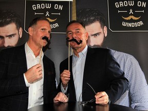 Prostate awareness champions Brian Schwab, left, and Marty Komsa hold up fake moustaches for the Grow On Windsor campaign. Proceeds of the fundraiser went to the Windsor Essex County Cancer Centre Foundation initiative to assist with local prostate cancer awareness, research and treatment.