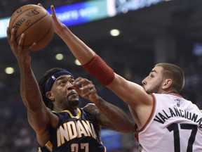 Indiana Pacers' Jordan Hill (27) drives to the basket as Toronto Raptors' Jonas Valanciunas (17) defends during first half NBA action in Toronto Wednesday Oct. 28, 2015. THE CANADIAN PRESS/Frank Gunn