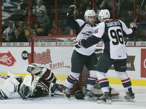Windsor's Aaron luchuk and Cristiano DiGiacinto celebrate after a Spitfire goal while Guelph goaltender, Justin Nichols, lays on his back in the second period of OHL action between the Windsor Spitfires and the Guelph Storm at the WFCU Centre, Saturday, Oct. 31, 2015.   (DAX MELMER/The Windsor Star)