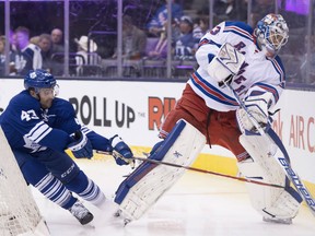 Toronto Maple Leafs Nazem Kadri (left) tries to get to the puck as New York Rangers goaltender Cam Talbot clears it during second period NHL action in Toronto on Tuesday February 10, 2015. THE CANADIAN PRESS/Frank Gunn