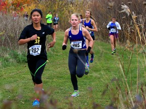 Junior girls Kaleigh Prieur, left, of Riverside and Ella Doornaert of Sandwich run the uphill portion of the course during SWOSSAA cross-country meet at Malden Park Thursday October 29, 2015. (NICK BRANCACCIO/Windsor Star)