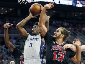 Detroit Pistons’ Stanley Johnson (3) goes to the basket against Chicago Bulls' Joakim Noah (13) during the first half of an NBA basketball game Friday, Oct. 30, 2015, in Auburn Hills, Mich. (AP Photo/Duane Burleson)