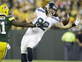 Seattle Seahawks' Luke Willson catches a pass in front of Green Bay Packers' Nate Palmer (51) during the second half of an NFL football game Sunday, Sept. 20, 2015, in Green Bay, Wis. (AP Photo/Jeffrey Phelps)