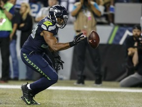 Linebacker K.J. Wright #50 of the Seattle Seahawks bats a loose ball out of the back of the end zone during the second half of a football game at CenturyLink Field on October 5, 2015 in Seattle, Washington. The Seahawks won the game 13-10. (Photo by Stephen Brashear/Getty Images)