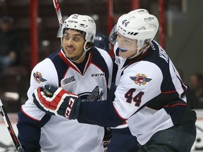 Windsor Spitfires Jalen Chatfield and Mike Kirwan celebrate a third period goal during the Ontario Hockey League game against the Saginaw Spirit at the WFCU Centre on October 1, 2015. (JASON KRYK/The Windsor Star)